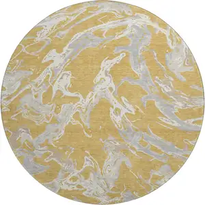 Photo of 8' Gold Gray And Beige Abstract Washable Round Rug With UV Protection
