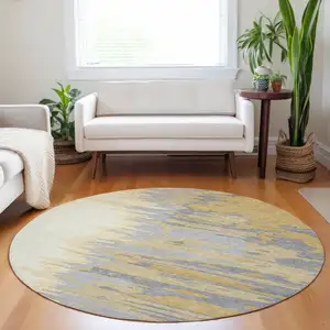 Photo of 8' Gold Gray And Beige Round Abstract Washable Indoor Outdoor Area Rug