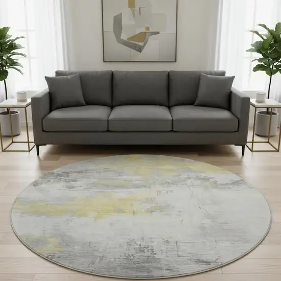 8' Gold Gray And Ivory Abstract Washable Round Rug With UV Protection Photo 2