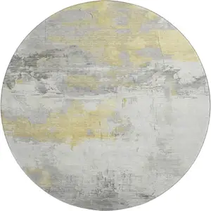 Photo of 8' Gold Gray And Ivory Abstract Washable Round Rug With UV Protection