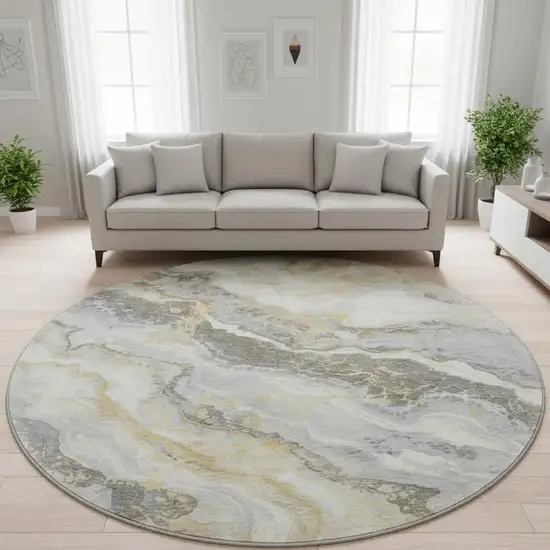 8' Gold Gray And Ivory Abstract Washable Round Rug With UV Protection Photo 2