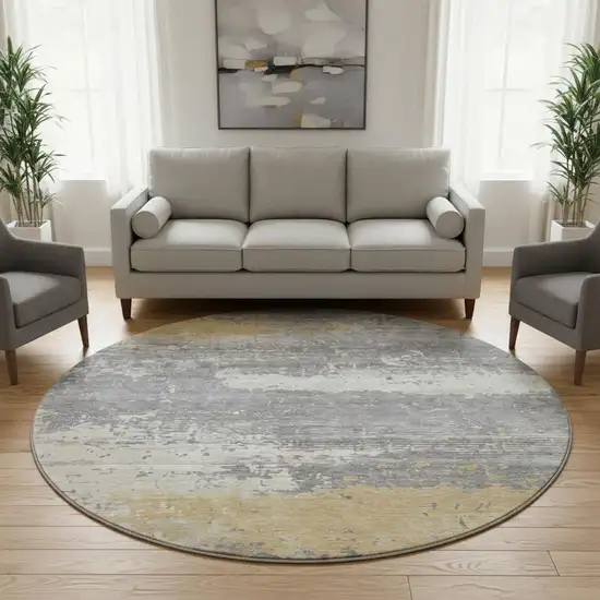 8' Gold Gray And Ivory Abstract Washable Round Rug With UV Protection Photo 2