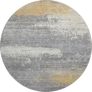 Photo of 8' Gold Gray And Ivory Abstract Washable Round Rug With UV Protection