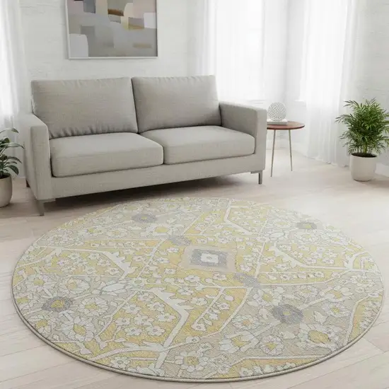 8' Gold Gray And Ivory Floral Washable Round Rug With UV Protection Photo 1