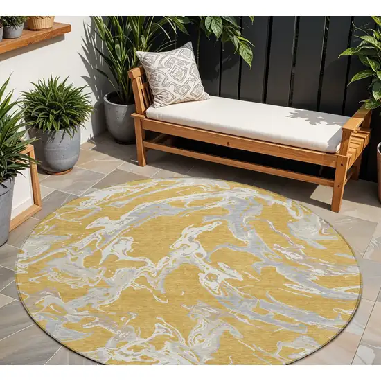 8' Gold Gray And Ivory Round Abstract Washable Indoor Outdoor Area Rug Photo 1