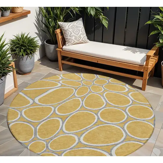 8' Gold Gray And Ivory Round Abstract Washable Indoor Outdoor Area Rug Photo 1