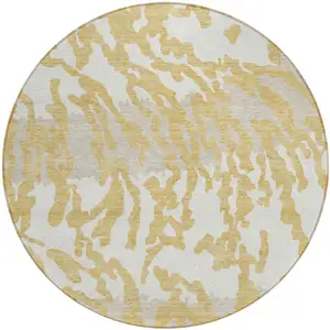 Photo of 8' Gold Gray And Ivory Round Animal Print Washable Indoor Outdoor Area Rug