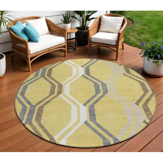 8' Gold Gray And Ivory Round Geometric Washable Indoor Outdoor Area Rug Photo 1