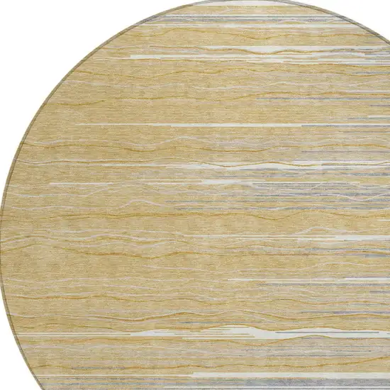 8' Gold Gray And Ivory Round Striped Washable Indoor Outdoor Area Rug Photo 3