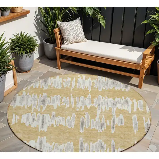 8' Gold Gray And Ivory Round Striped Washable Indoor Outdoor Area Rug Photo 1