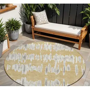 Photo of 8' Gold Gray And Ivory Round Striped Washable Indoor Outdoor Area Rug