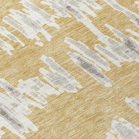 8' Gold Gray And Ivory Round Striped Washable Indoor Outdoor Area Rug Photo 4