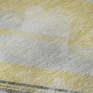 Photo of 8' Gold Gray And Ivory Striped Washable Area Rug With UV Protection