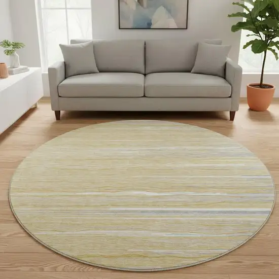 8' Gold Gray And Ivory Striped Washable Round Rug With UV Protection Photo 2