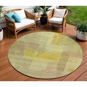 Photo of 8' Gold Green And Brown Round Abstract Washable Indoor Outdoor Area Rug