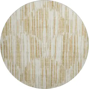 Photo of 8' Gold Ivory And Beige Abstract Washable Round Rug With UV Protection