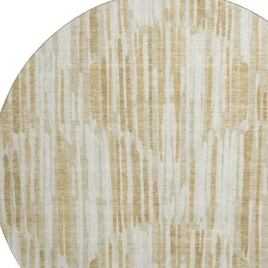 8' Gold Ivory And Beige Abstract Washable Round Rug With UV Protection Photo 3