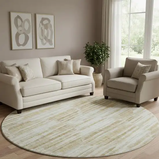 8' Gold Ivory And Beige Abstract Washable Round Rug With UV Protection Photo 1