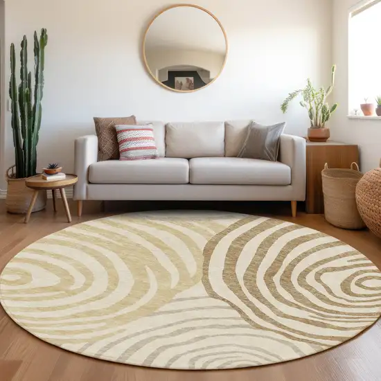 8' Gold Ivory And Beige Round Abstract Washable Indoor Outdoor Area Rug Photo 6