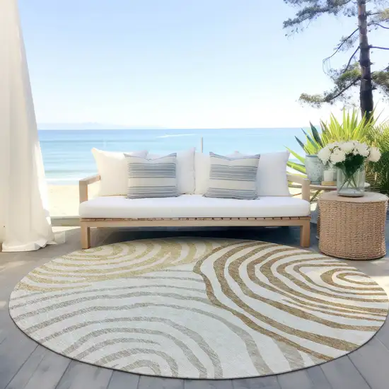 8' Gold Ivory And Beige Round Abstract Washable Indoor Outdoor Area Rug Photo 5