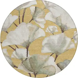 Photo of 8' Gold Ivory And Beige Round Botanical Leaves Washable Indoor Outdoor Area Rug