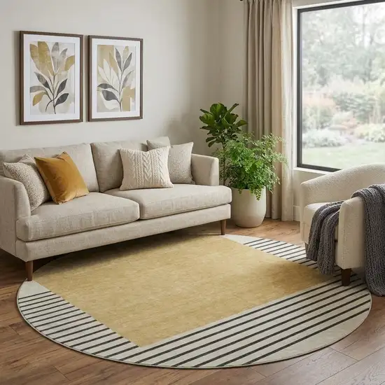 8' Gold Ivory And Black Striped Washable Round Rug With UV Protection Photo 1