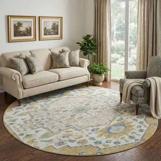 8' Gold Ivory And Blue Oriental Washable Round Rug With UV Protection Photo 1