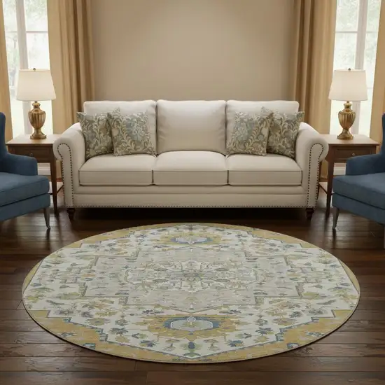 8' Gold Ivory And Blue Oriental Washable Round Rug With UV Protection Photo 2