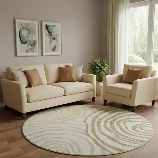 8' Gold Ivory And Brown Abstract Washable Round Rug With UV Protection Photo 1