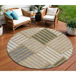 Photo of 8' Gold Ivory And Charcoal Round Geometric Washable Indoor Outdoor Area Rug