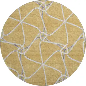 Photo of 8' Gold Ivory And Gray Geometric Washable Round Rug With UV Protection