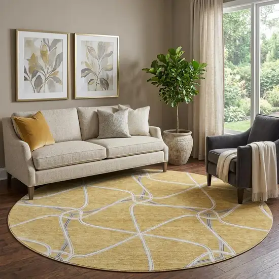8' Gold Ivory And Gray Geometric Washable Round Rug With UV Protection Photo 1