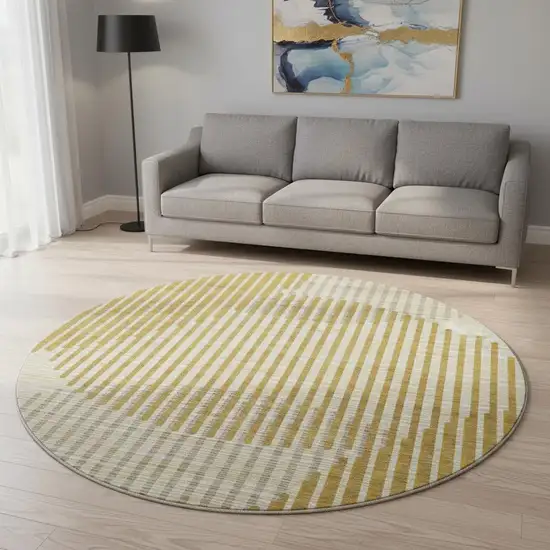8' Gold Ivory And Gray Geometric Washable Round Rug With UV Protection Photo 2