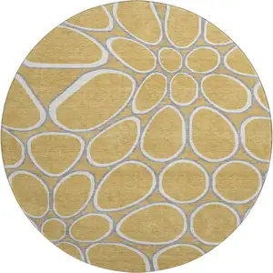 Photo of 8' Gold Ivory And Gray Geometric Washable Round Rug With UV Protection