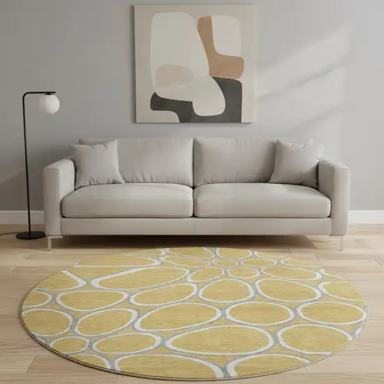 8' Gold Ivory And Gray Geometric Washable Round Rug With UV Protection Photo 2