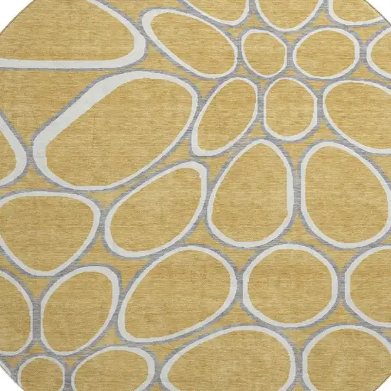 8' Gold Ivory And Gray Geometric Washable Round Rug With UV Protection Photo 2