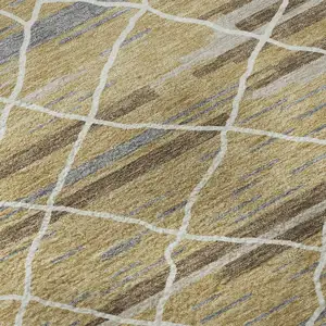 Photo of 8' Gold Ivory And Gray Striped Washable Round Rug With UV Protection