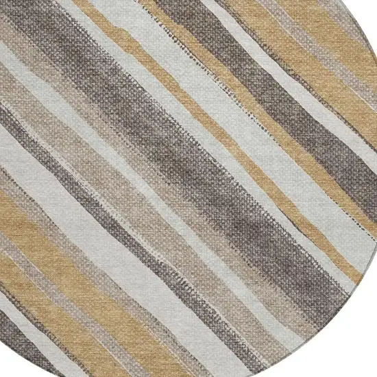 8' Gold Ivory And Taupe Round Striped Washable Indoor Outdoor Area Rug Photo 6