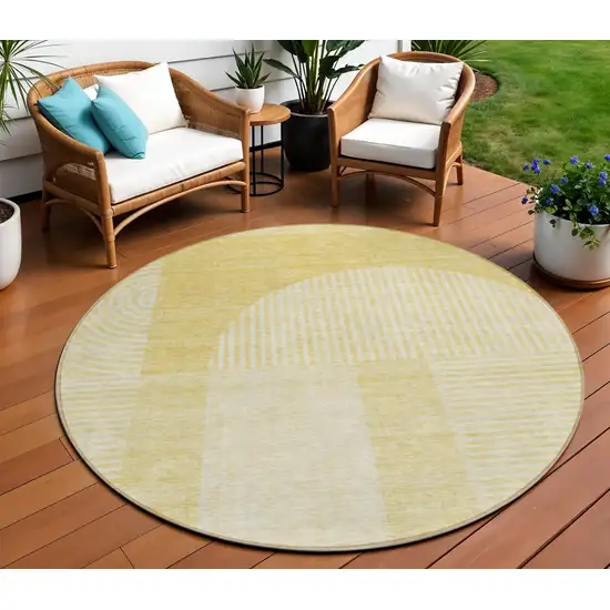 8' Gold Ivory And Yellow Round Geometric Washable Indoor Outdoor Area Rug Photo 1