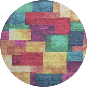 Photo of 8' Gold Purple And Red Geometric Washable Round Rug With UV Protection