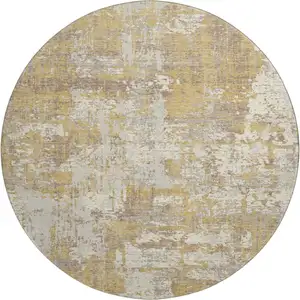 Photo of 8' Gold Taupe And Beige Abstract Washable Round Rug With UV Protection