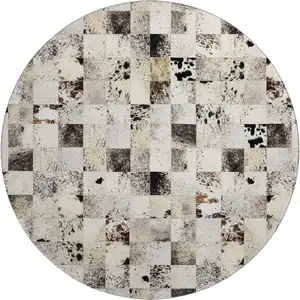 Photo of 8' Granite Gray Ivory And Black Patchwork Washable Round Rug With UV Protection