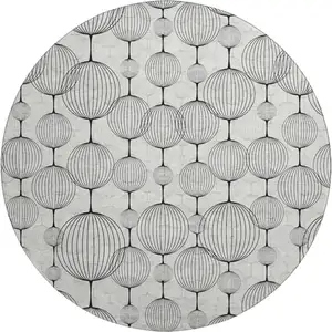 Photo of 8' Graphite And Silver Geometric Washable Round Rug With UV Protection
