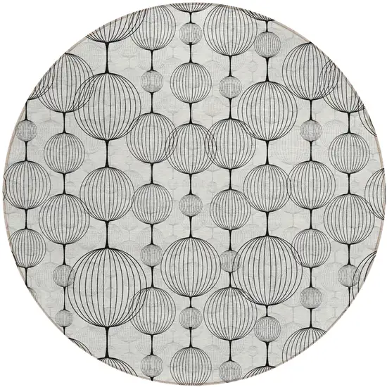 8' Graphite Gray And Silver Round Geometric Washable Indoor Outdoor Area Rug Photo 1