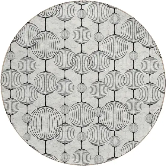 8' Graphite Gray And Silver Round Geometric Washable Indoor Outdoor Area Rug Photo 1