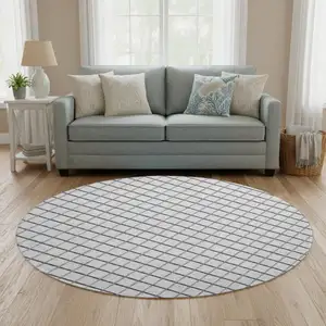 Photo of 8' Gray And Black Geometric Washable Round Rug With UV Protection