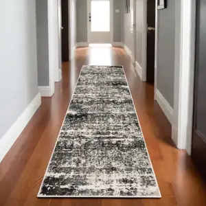 Photo of 8' Gray And Ivory Abstract Runner Rug