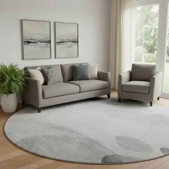 8' Gray And Ivory Abstract Washable Round Rug With UV Protection Photo 1