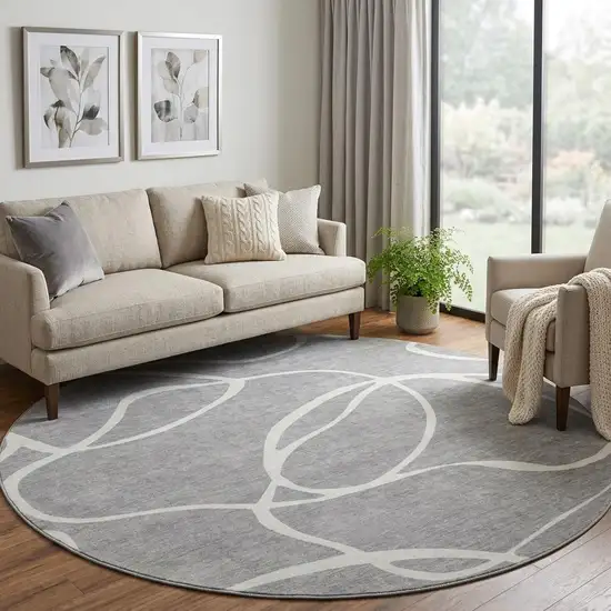 8' Gray And Ivory Abstract Washable Round Rug With UV Protection Photo 1