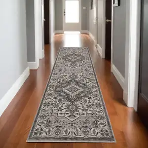 Photo of 8' Gray And Ivory Medallion Runner Rug With Fringe